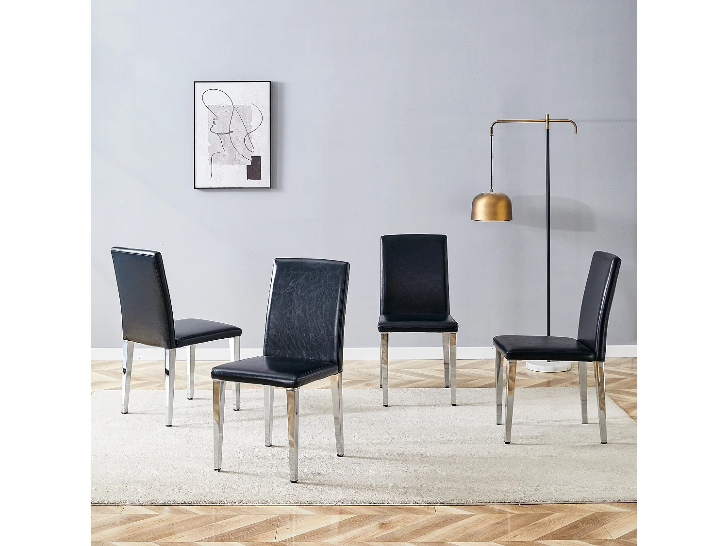 Set van 4 eetkamerstoelen in zwart kunstleer met zilverkleurige metalen poten