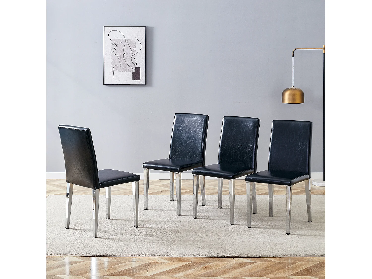 Set van 4 eetkamerstoelen in zwart kunstleer met zilverkleurige metalen poten