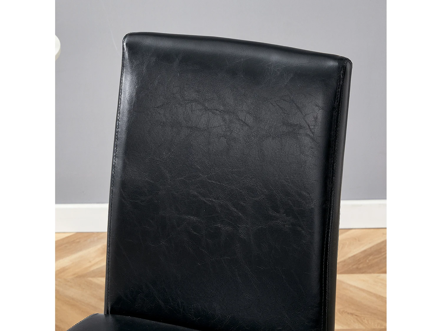 Set van 4 eetkamerstoelen in zwart kunstleer met zilverkleurige metalen poten