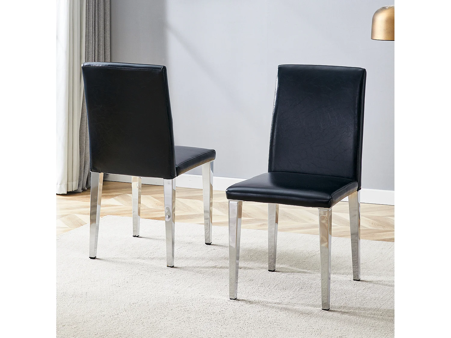 Lot de 2 chaises de salle à manger en similicuir noir avec pieds en métal argenté