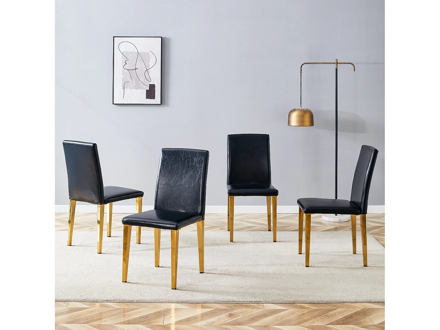 Lot de 4 chaises de salle à manger en similicuir noir avec pieds en métal doré