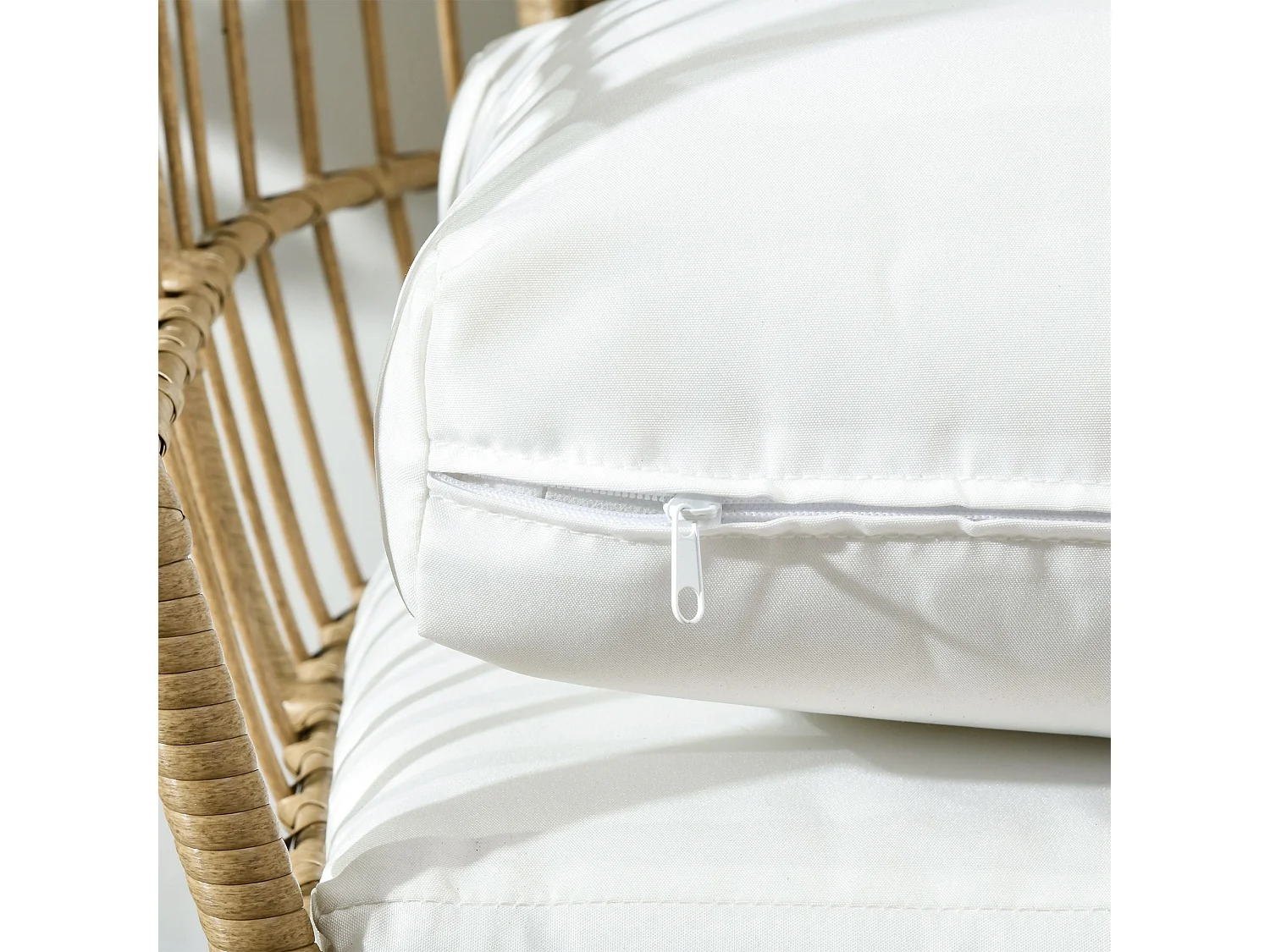 Khaki Rattan Style Egg Chair with White Cushions and Pillows