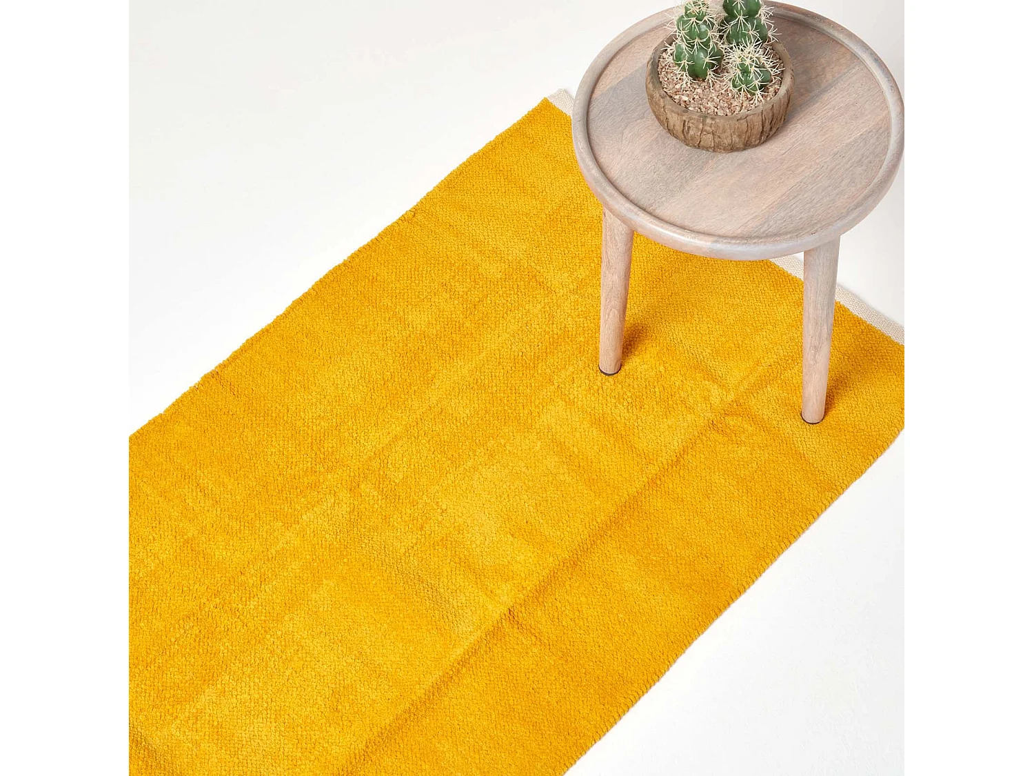 Homescapes Mustard 100% Cotton Plain Chenille Rug with Natural Trim, 66 x 200 cm