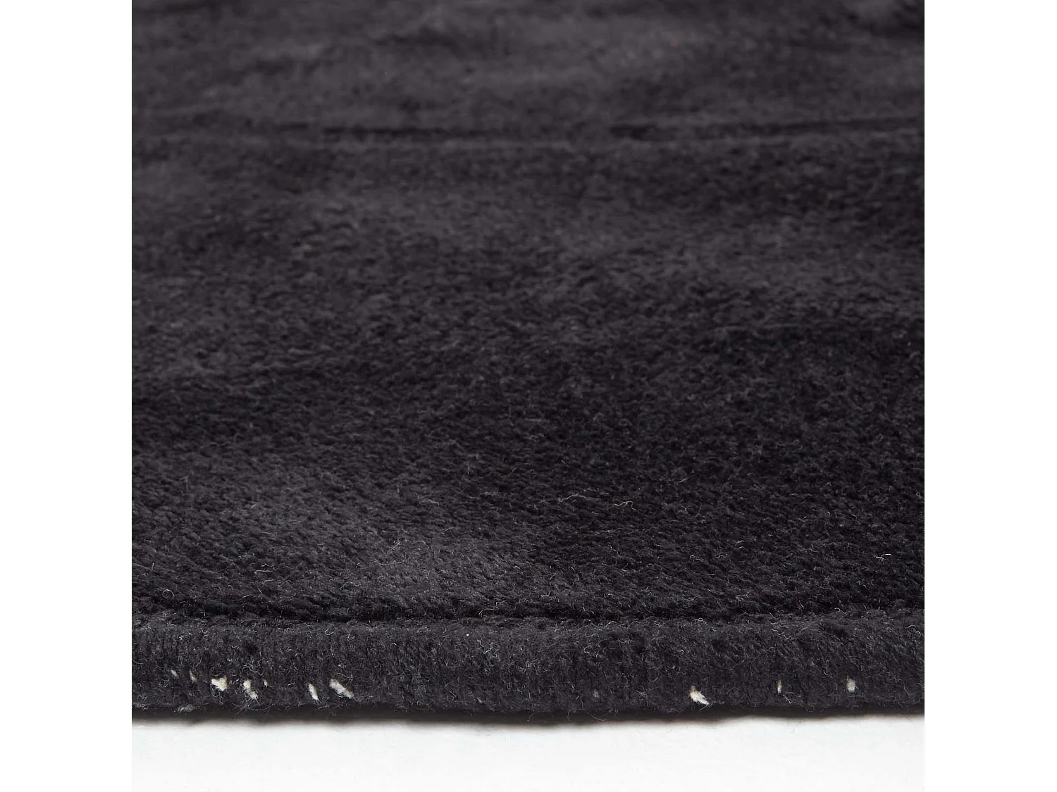 Homescapes Hand Tufted Plain Cotton Black Large Round Rug, 150 cm Diameter