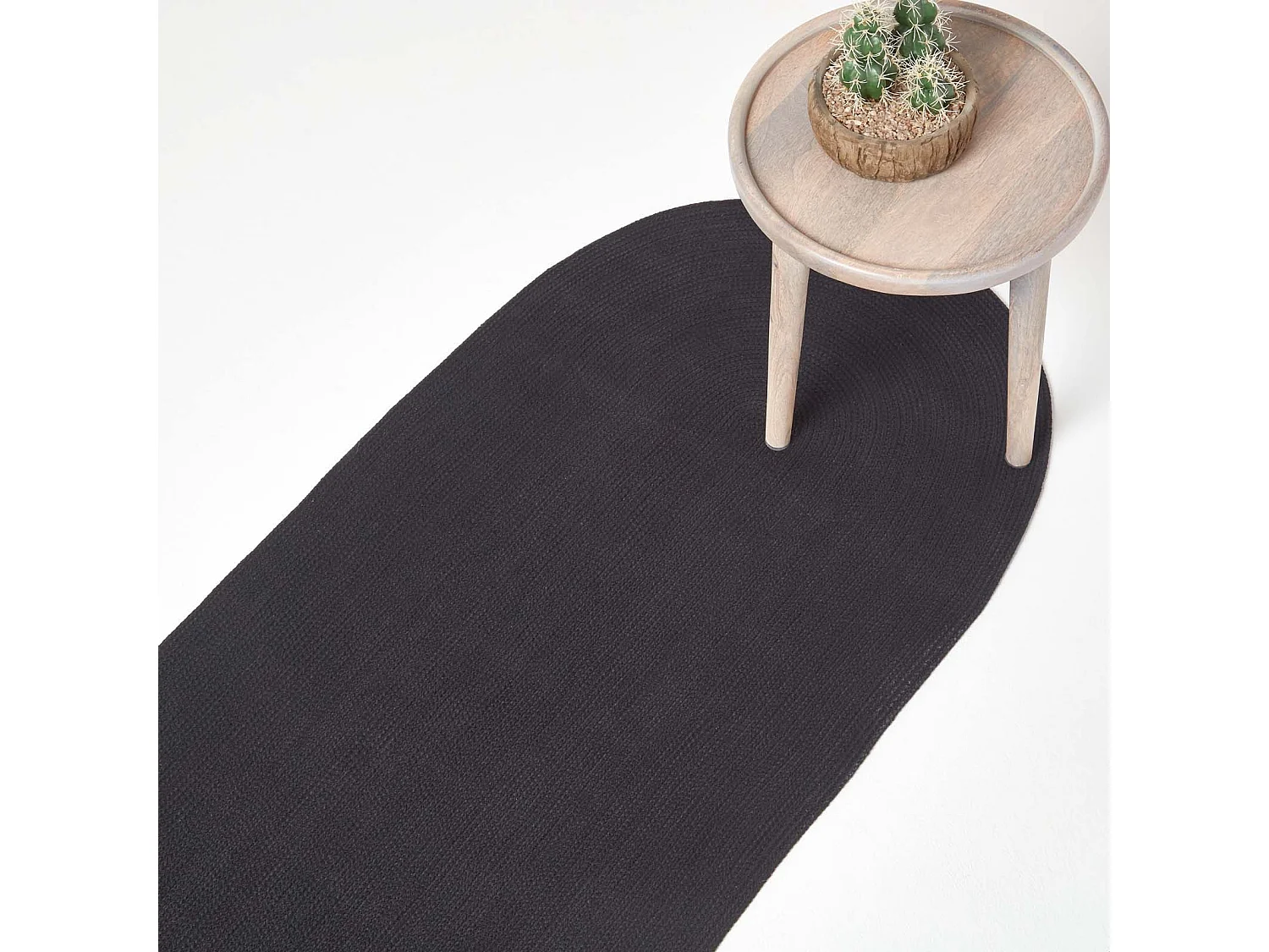 Homescapes Black Handmade Woven Braided Oval Rug, 66 x 200 cm