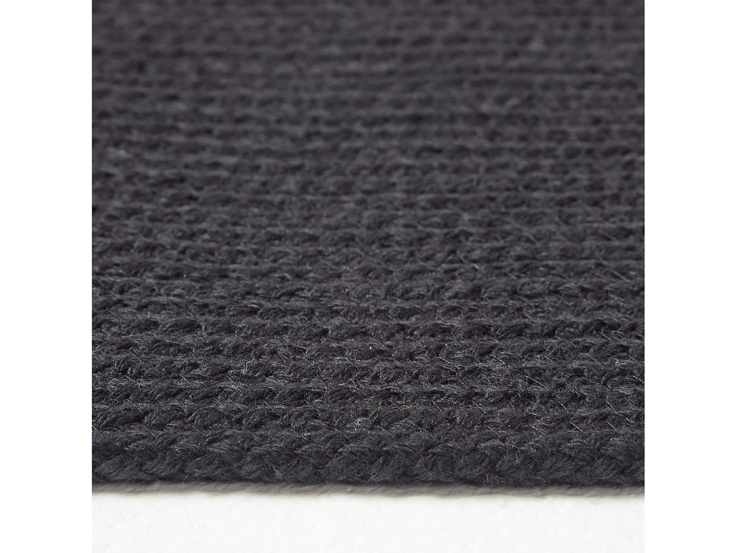 Homescapes Black Handmade Woven Braided Oval Rug, 66 x 200 cm