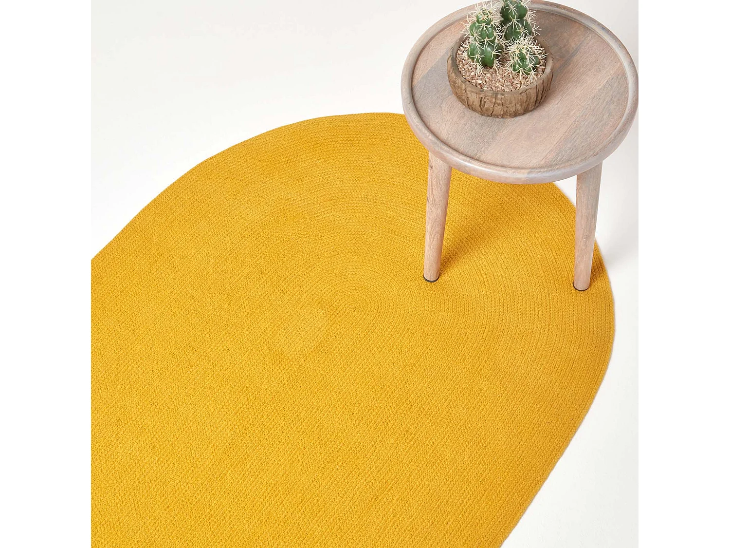 Homescapes Mustard Yellow Handmade Woven Braided Oval Rug, 60 x 90 cm