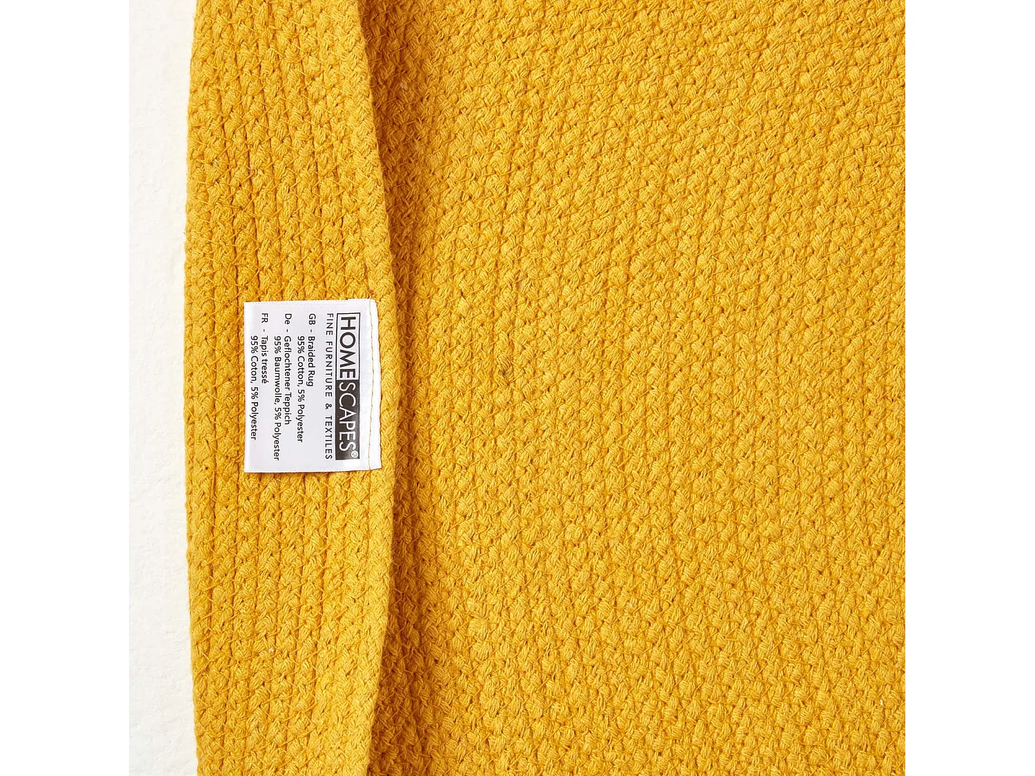 Homescapes Mustard Yellow Handmade Woven Braided Oval Rug, 60 x 90 cm