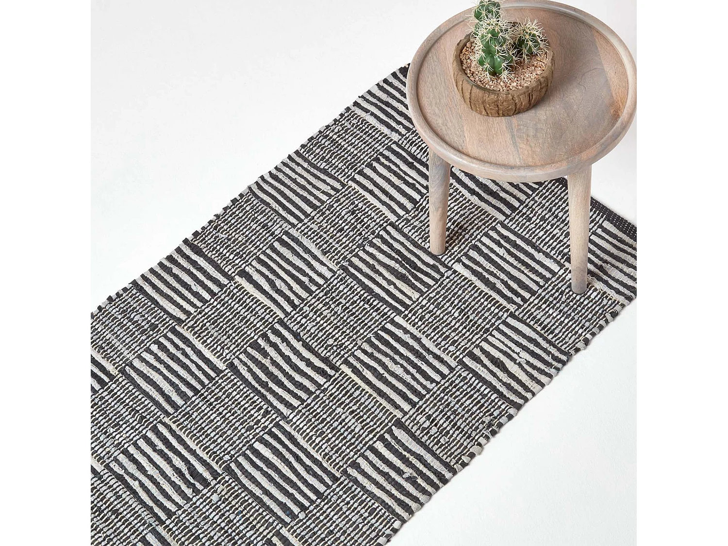Homescapes Black & White Real Leather Handwoven Striped Block Check Rug, 66 x 200 cm