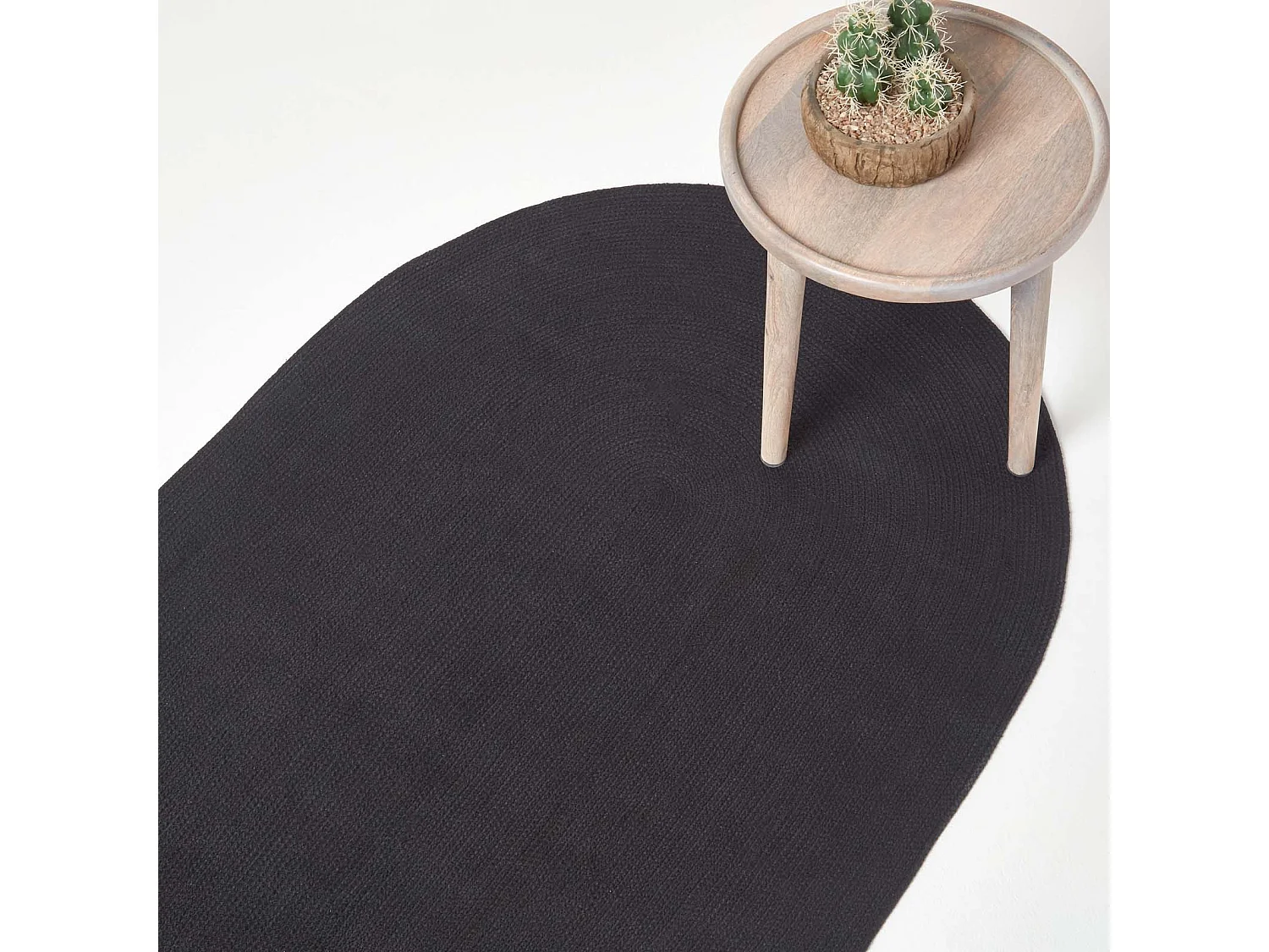 Homescapes Black Handmade Woven Braided Oval Rug, 90 x 150 cm