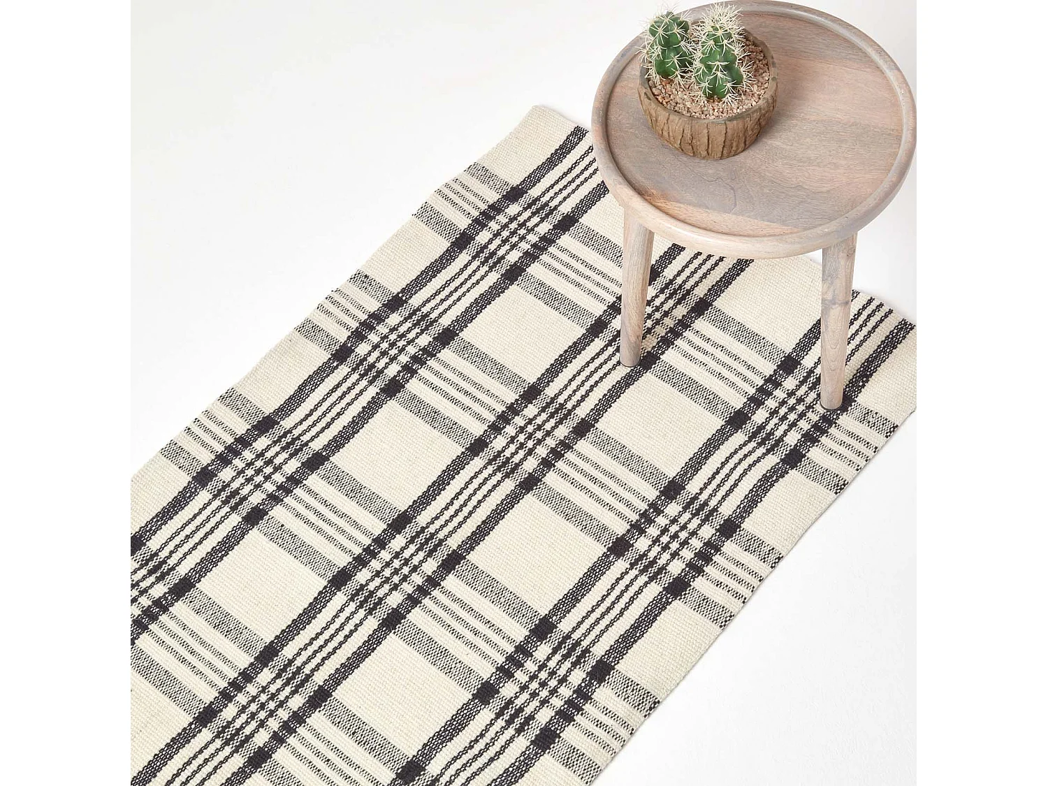 Homescapes Logan Black and White Tartan Check Non-Slip 100% Wool Rug, 66 x 200 cm