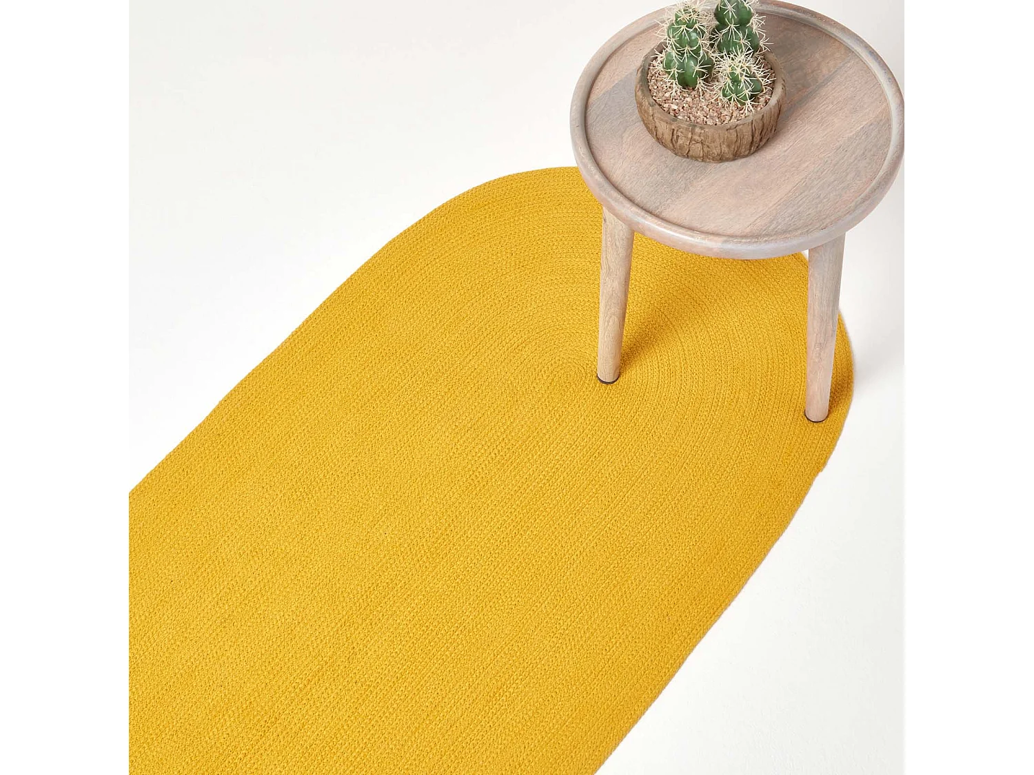 Homescapes Mustard Yellow Handmade Woven Braided Oval Hallway Rug, 66 x 200 cm