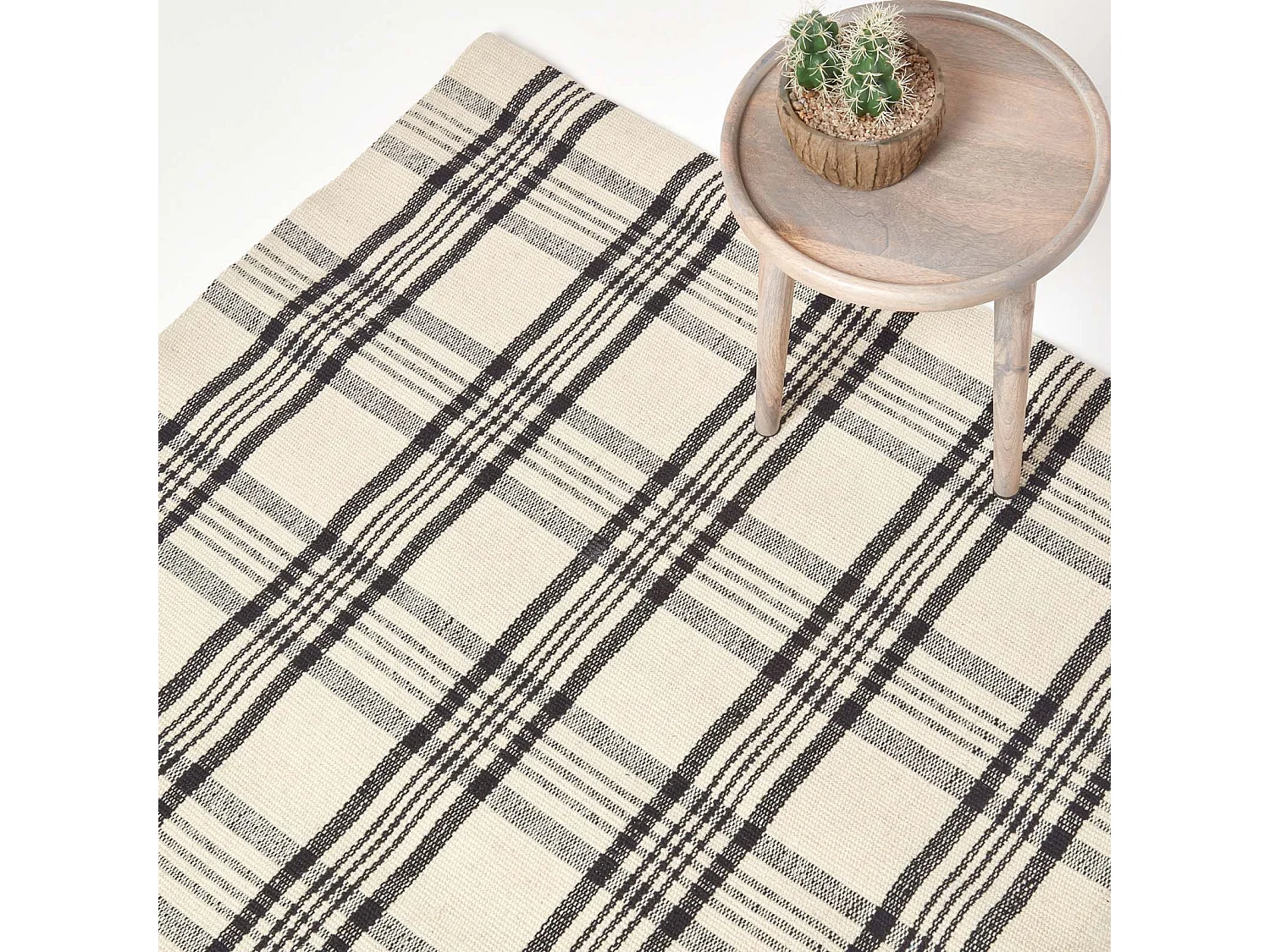 Homescapes Logan Black and White Tartan Check Non-Slip 100% Wool Rug, 70 x 120 cm