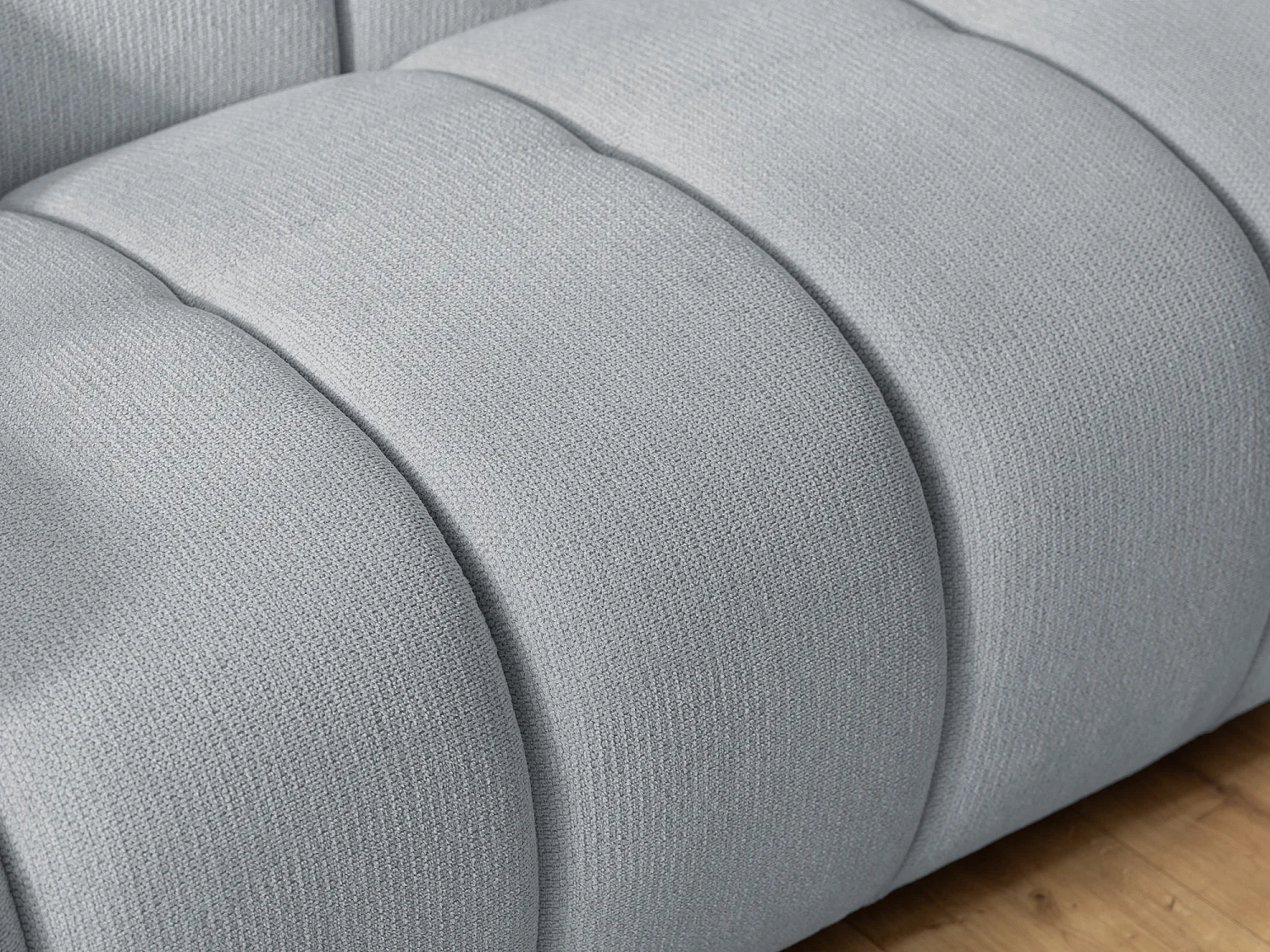 Fauteuil confortable au design moderne, avec un revêtement en tissu texturé doux et un capitonnage profond en style bubble - NUBIRA