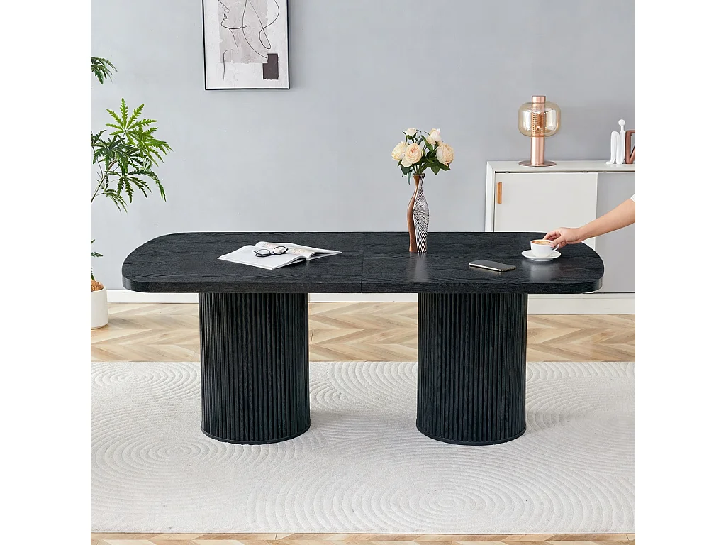 Table à manger ovale, dotée de pieds cylindriques rainurés, avec un plateau en MDF imitation bois de haute qualité, noir