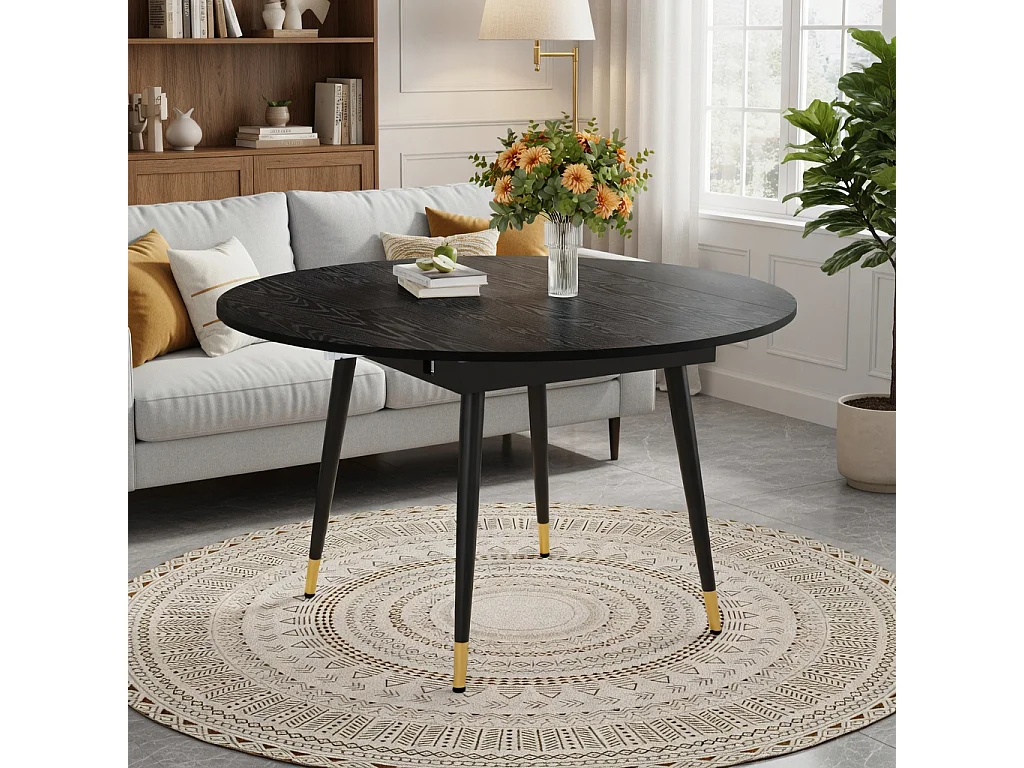 Table à rallonges, pouvant passer d'une forme ronde à une forme ovale, plateau en MDF rehaussé de touches dorées, noir