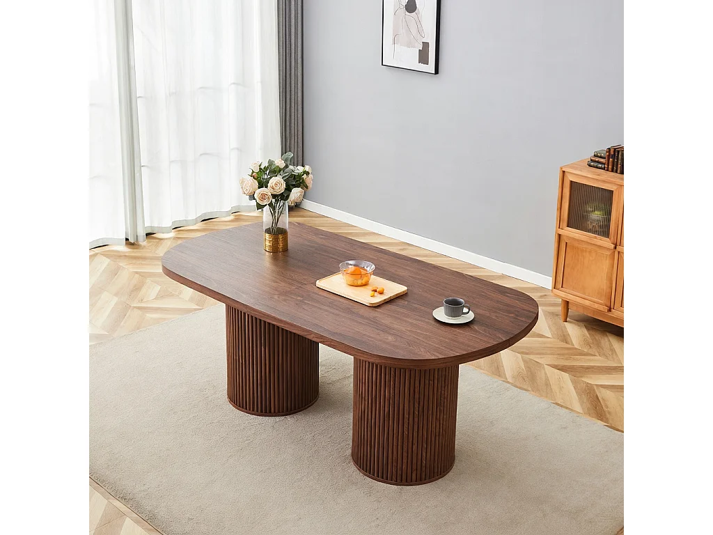 Table à manger ovale, dotée de pieds cylindriques rainurés, avec un plateau en MDF imitation bois de haute qualité, couleur noyer
