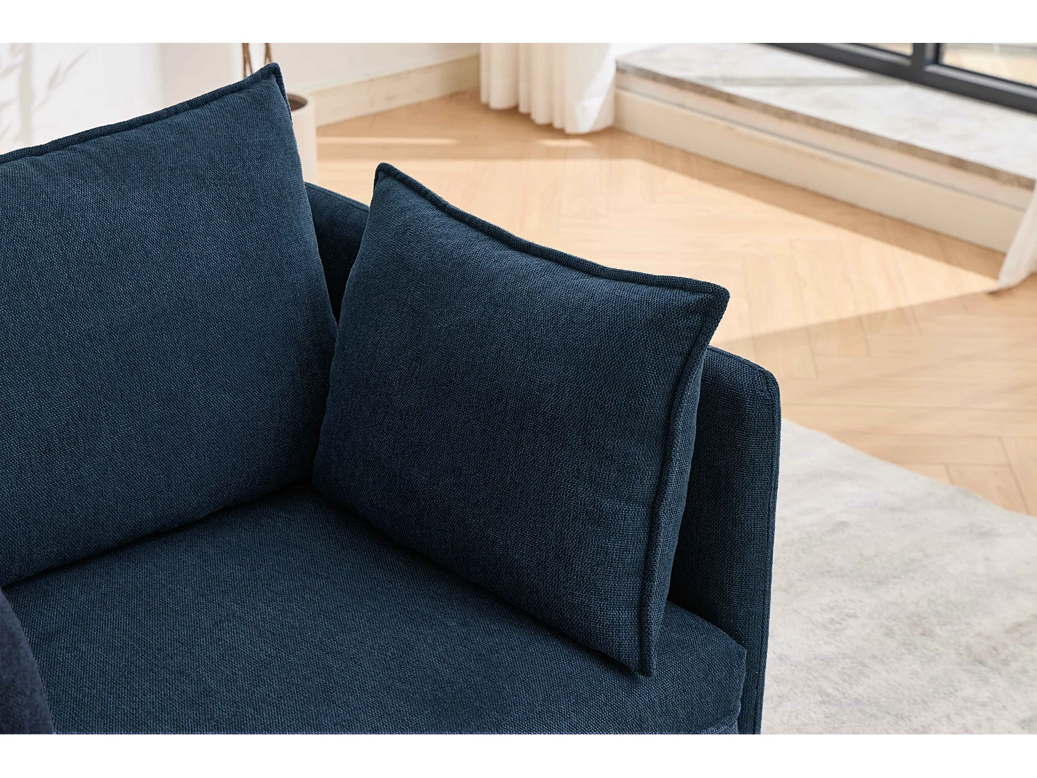 Fauteuil relax bleu foncé en chenille, avec repose-pieds et rangement intégré, design scandinave