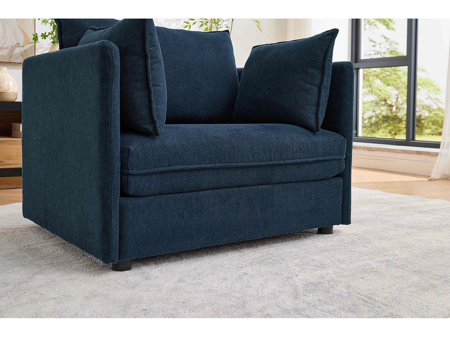 Fauteuil relax bleu foncé en chenille, avec repose-pieds et rangement intégré, design scandinave