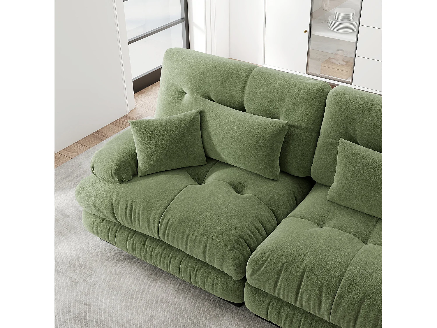 Canapé d'angle 3 places capitonné en chenille vert, avec pouf