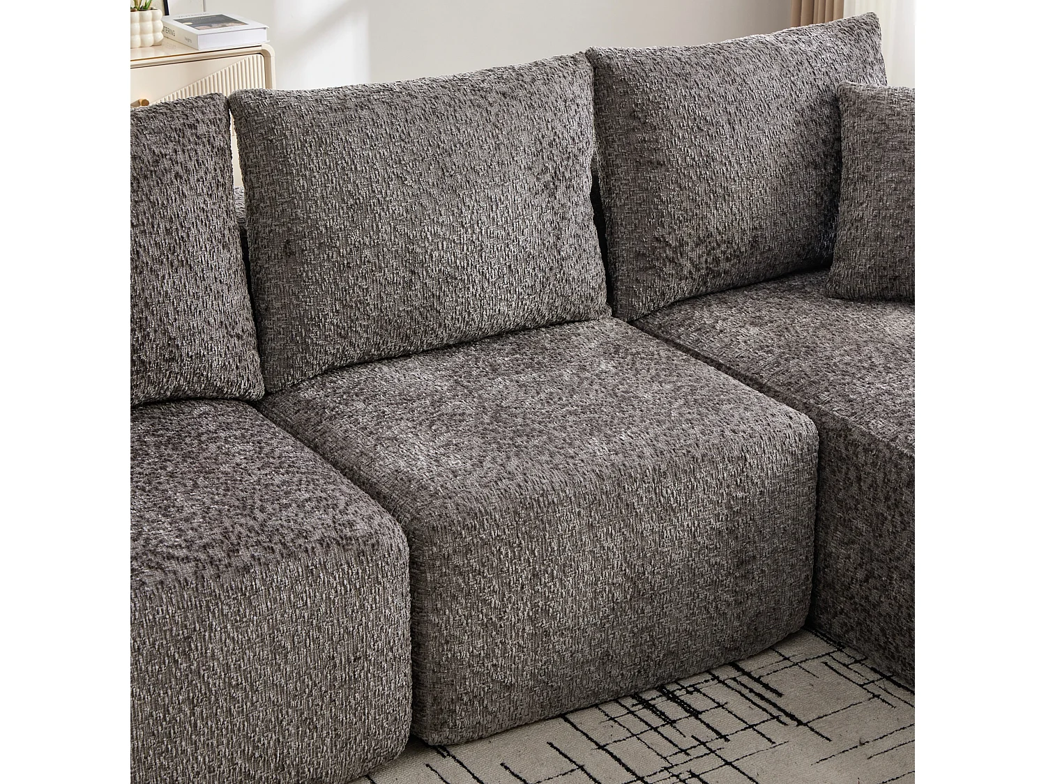 Canapé d’angle 3 places en chenille gris bouclette texturée accoudoirs