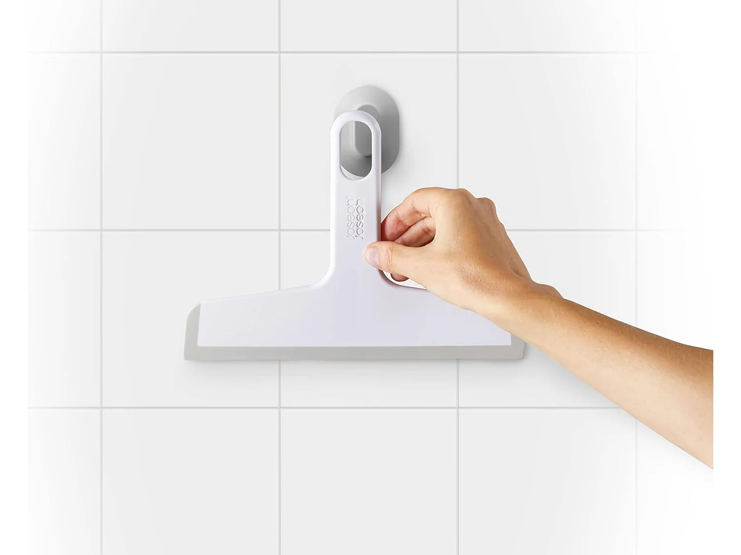 Raclette Joseph Joseph Duo avec ventouse, design compact et manche confortable, idéale pour salles de bain, vitres, carreaux et surfaces lisses.