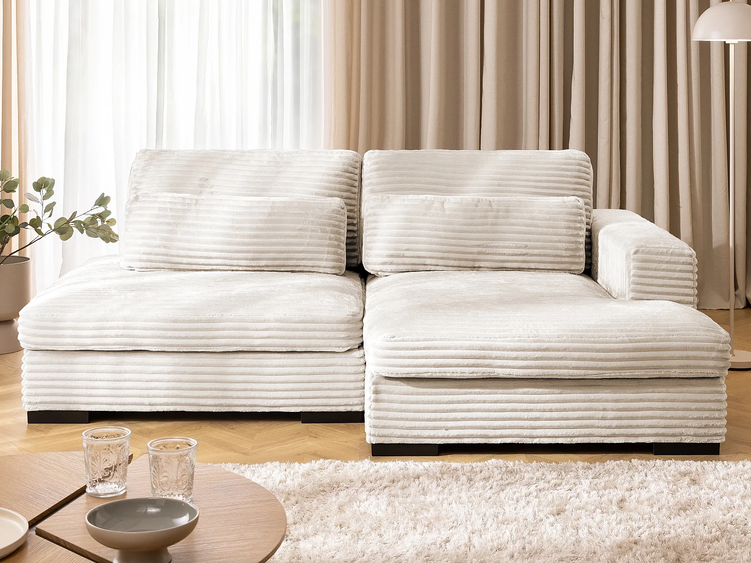 Canapé d’angle avec assise profonde, fonction couchage et pratique coffre de rangement, en tissu côtelé doux WOLKE