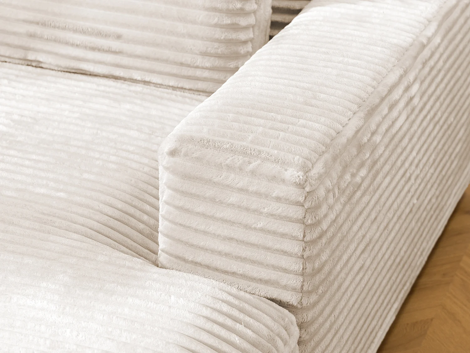 Canapé d’angle avec assise profonde, fonction couchage et pratique coffre de rangement, en tissu côtelé doux WOLKE