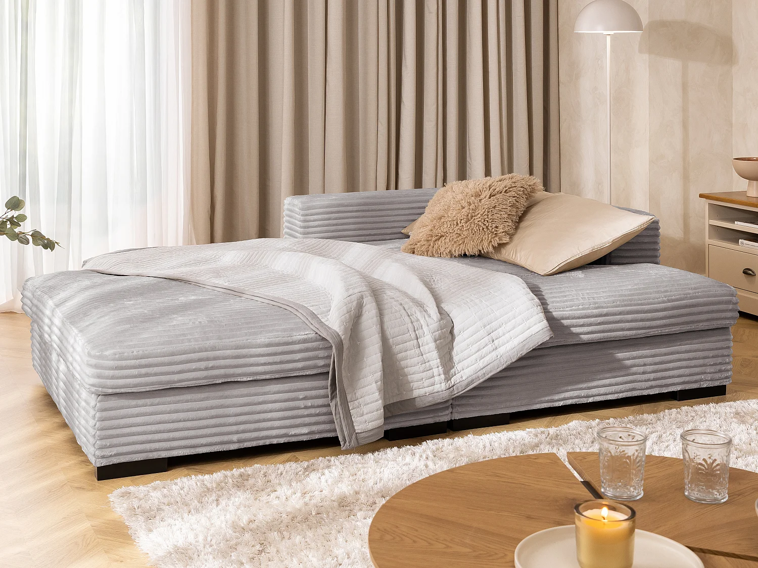 Canapé d’angle avec assise profonde, fonction couchage et pratique coffre de rangement, en tissu côtelé doux WOLKE