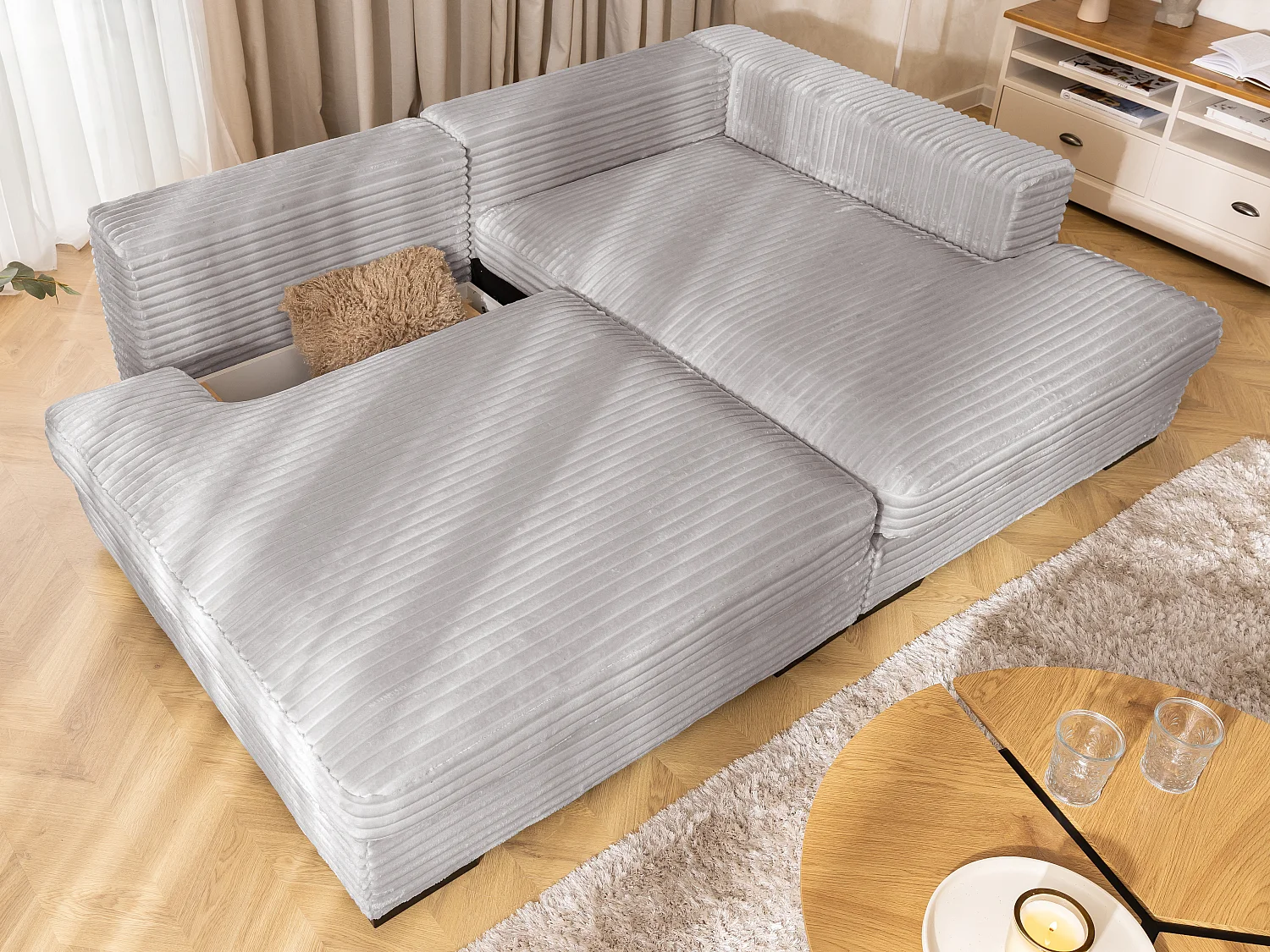 Canapé d’angle avec assise profonde, fonction couchage et pratique coffre de rangement, en tissu côtelé doux WOLKE
