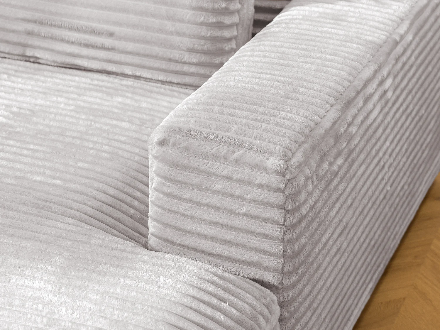 Canapé d’angle avec assise profonde, fonction couchage et pratique coffre de rangement, en tissu côtelé doux WOLKE