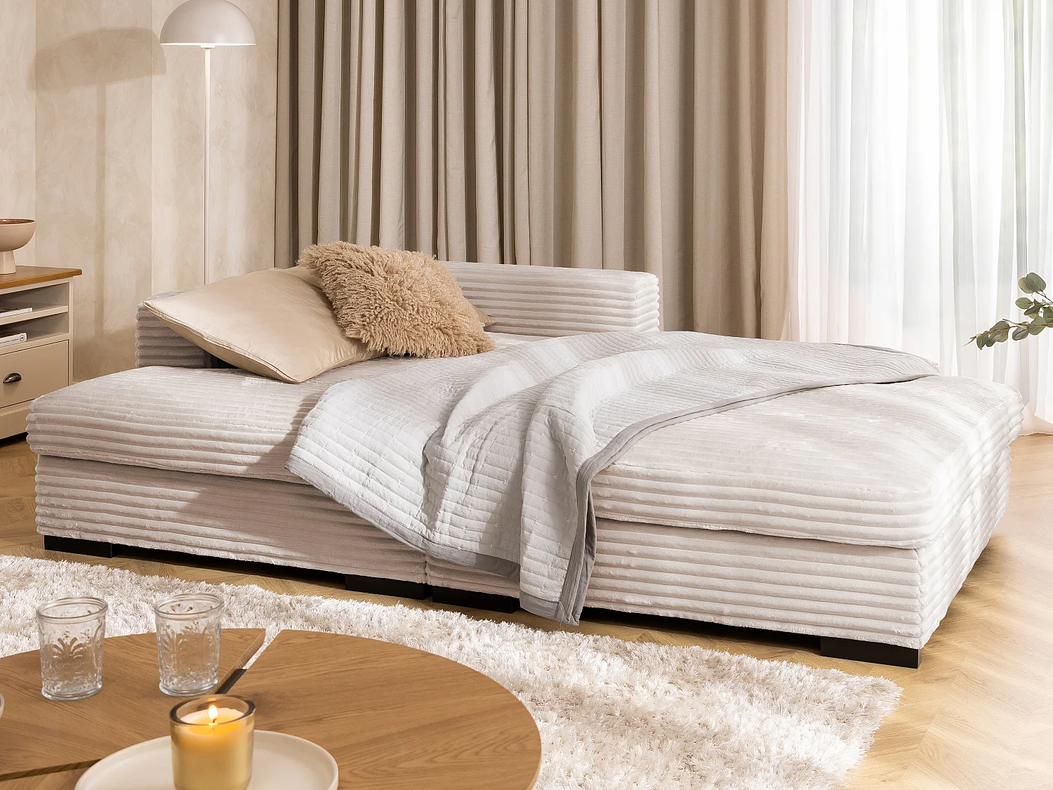 Canapé d’angle avec assise profonde, fonction couchage et pratique coffre de rangement, en tissu côtelé doux WOLKE