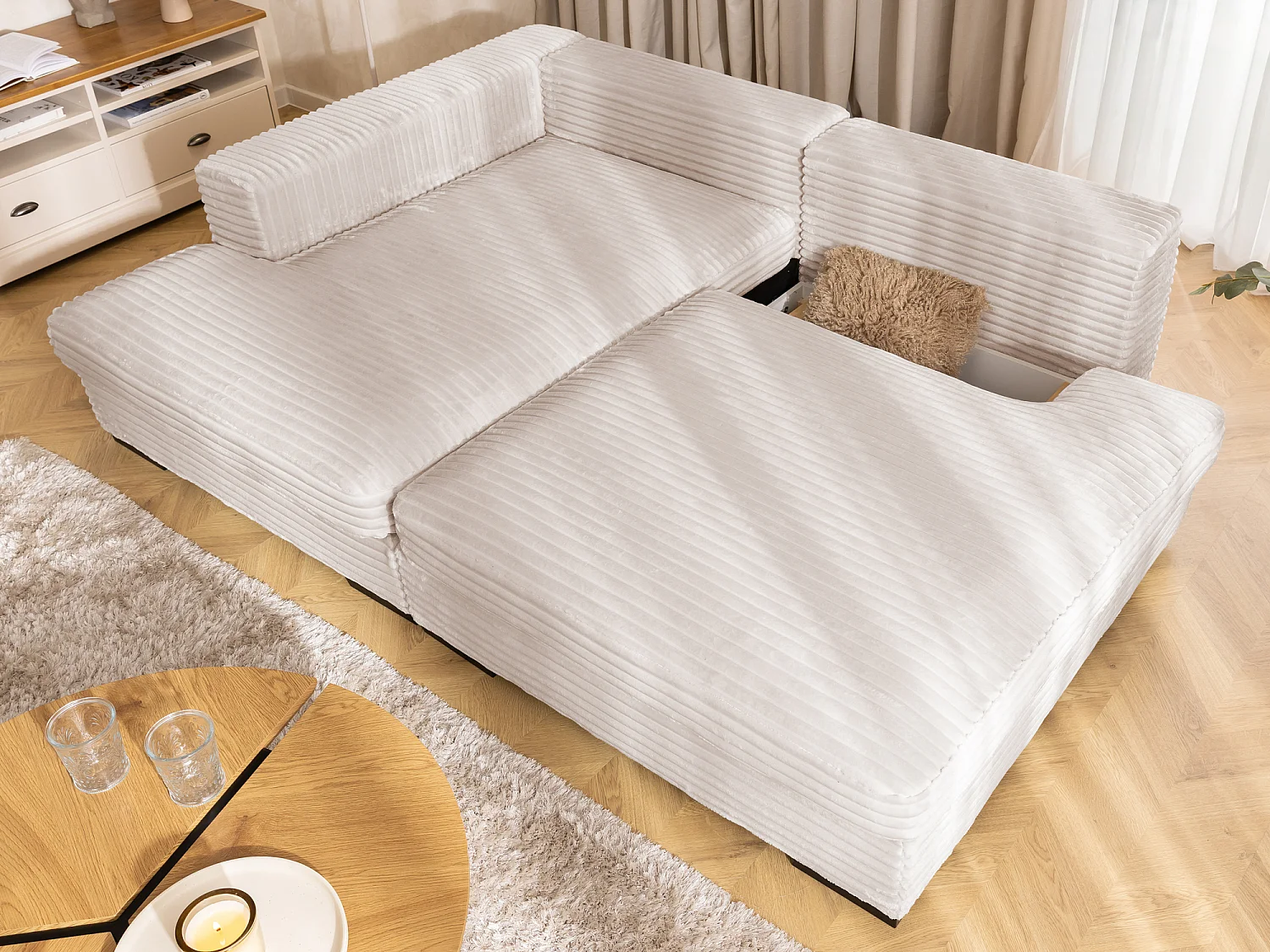 Canapé d’angle avec assise profonde, fonction couchage et pratique coffre de rangement, en tissu côtelé doux WOLKE