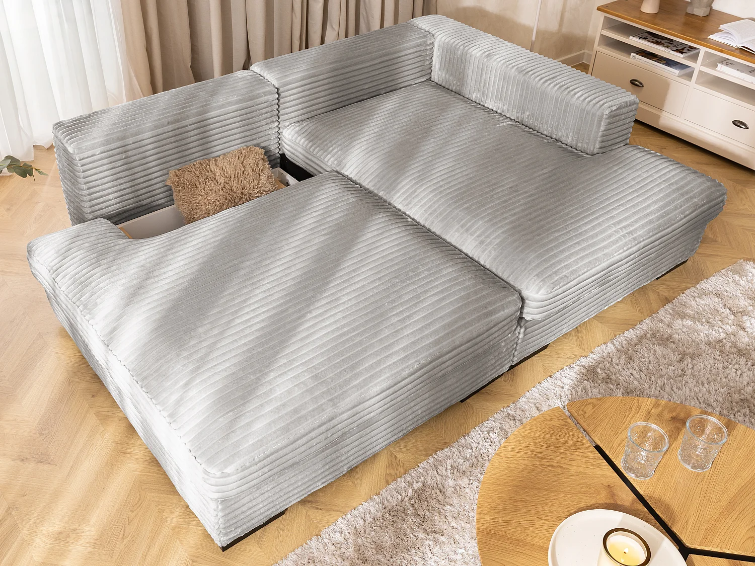 Canapé d’angle avec assise profonde, fonction couchage et pratique coffre de rangement, en tissu côtelé doux WOLKE