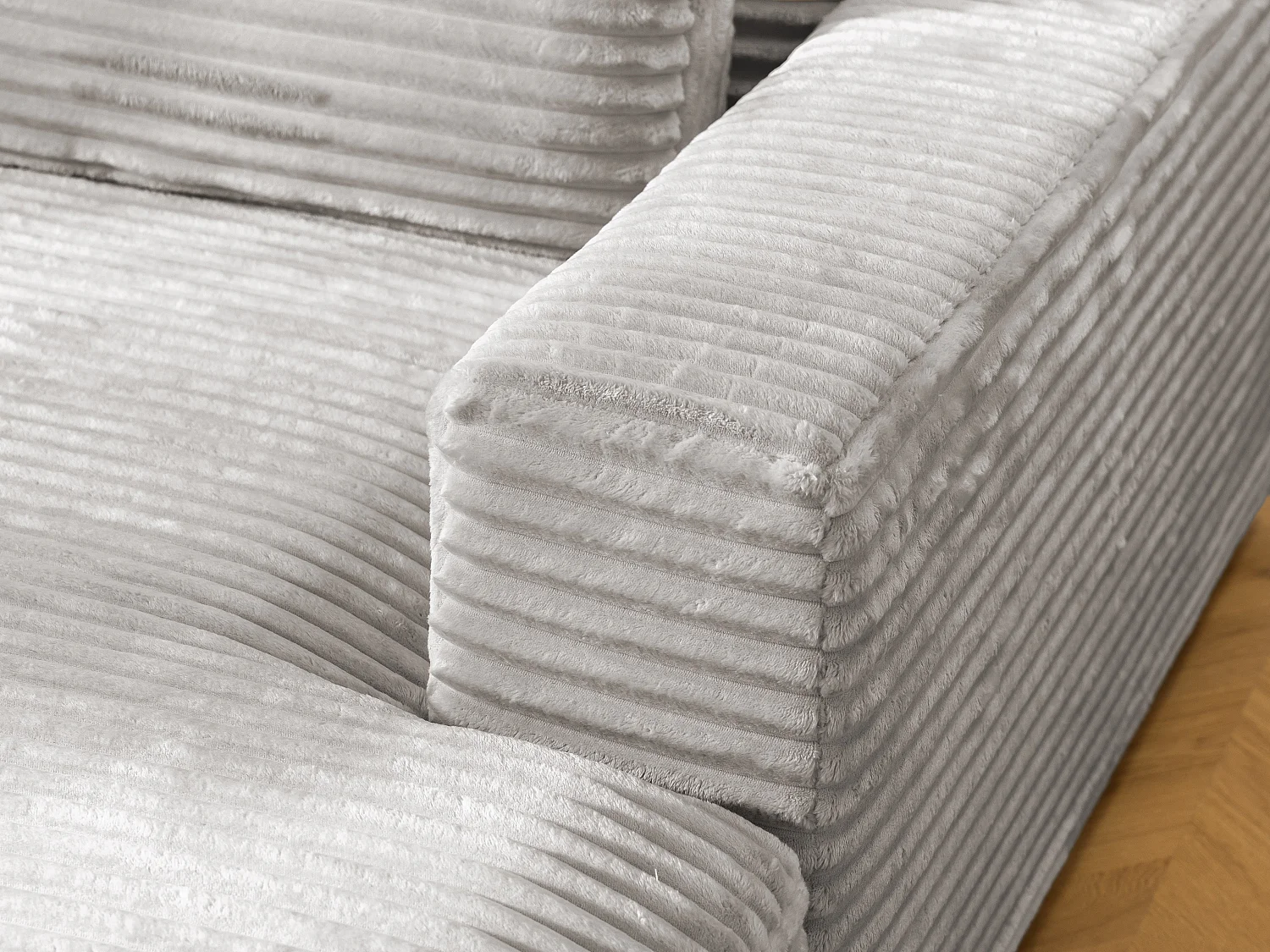 Canapé d’angle avec assise profonde, fonction couchage et pratique coffre de rangement, en tissu côtelé doux WOLKE