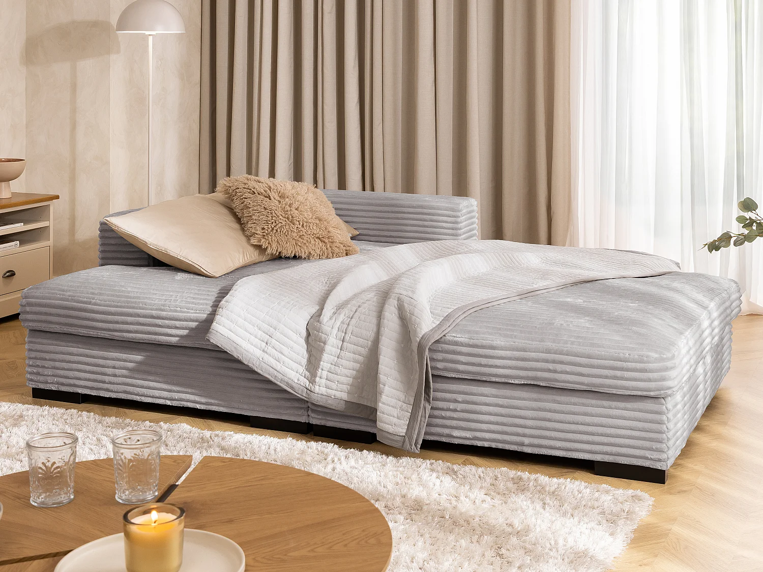 Canapé d’angle avec assise profonde, fonction couchage et pratique coffre de rangement, en tissu côtelé doux WOLKE