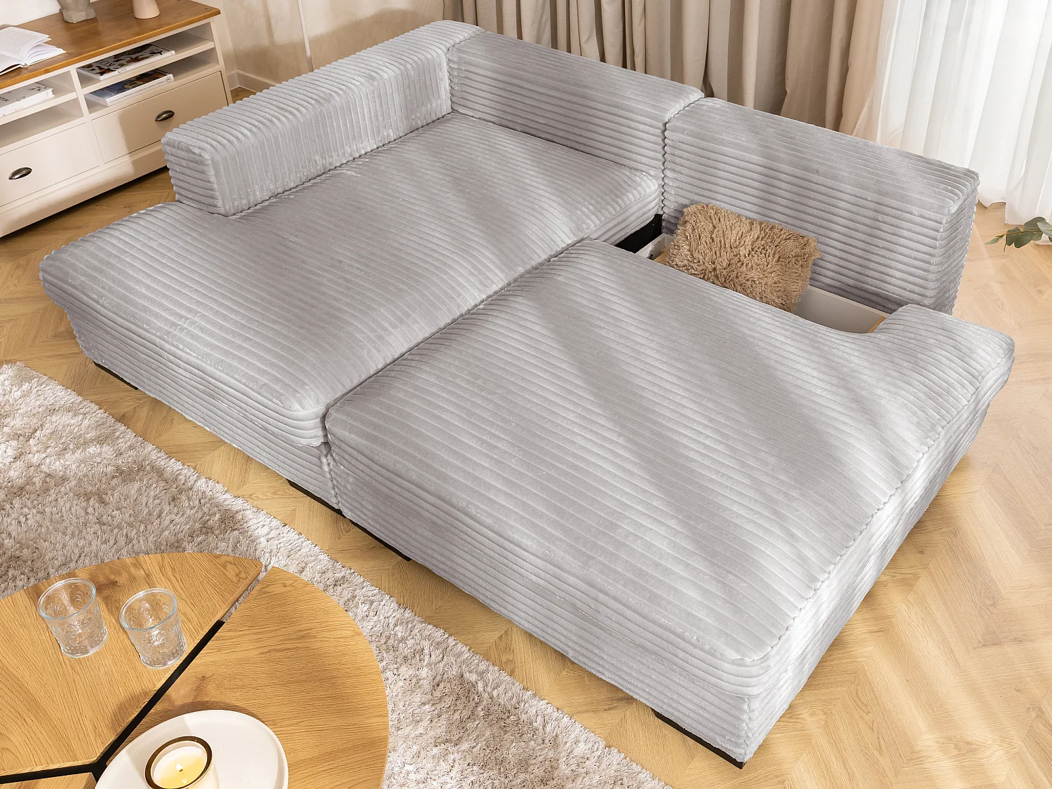 Canapé d’angle avec assise profonde, fonction couchage et pratique coffre de rangement, en tissu côtelé doux WOLKE