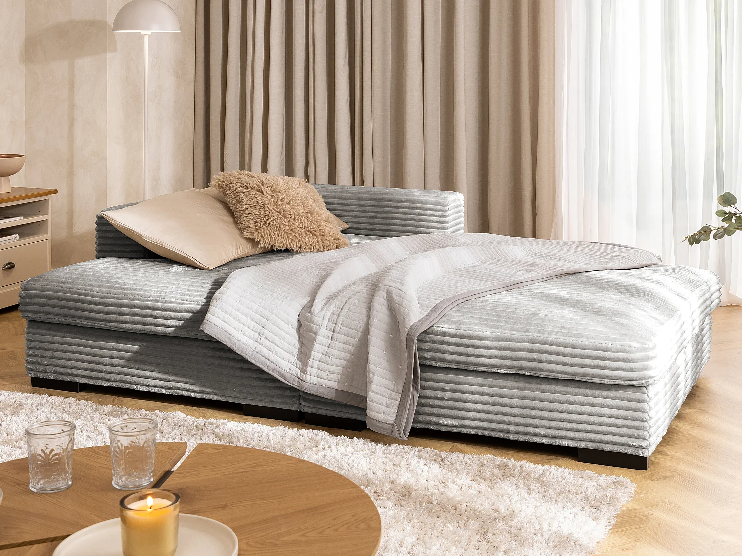 Canapé d’angle avec assise profonde, fonction couchage et pratique coffre de rangement, en tissu côtelé doux WOLKE