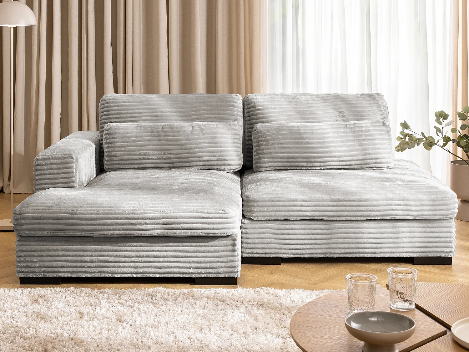 Canapé d’angle avec assise profonde, fonction couchage et pratique coffre de rangement, en tissu côtelé doux WOLKE