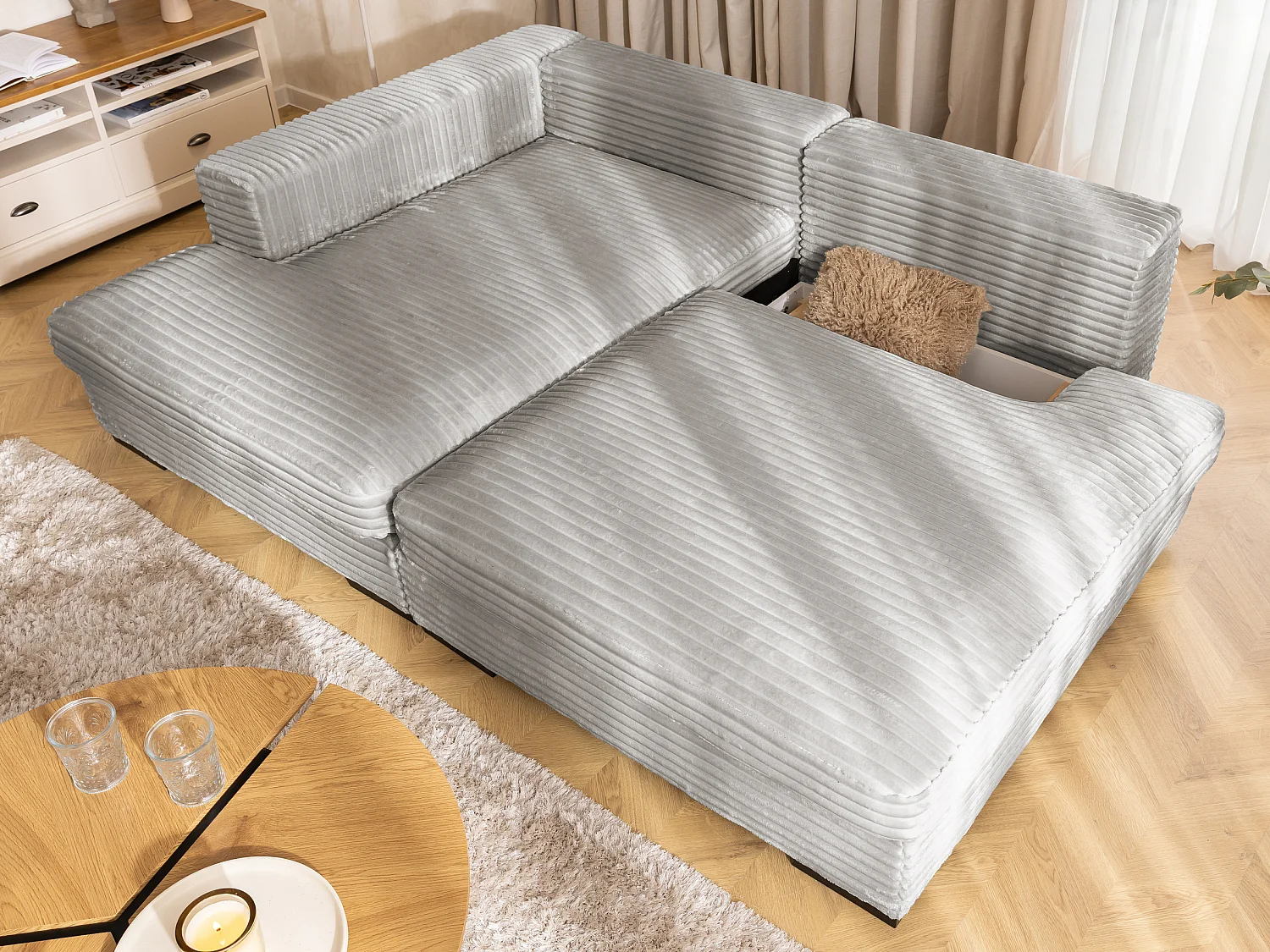 Canapé d’angle avec assise profonde, fonction couchage et pratique coffre de rangement, en tissu côtelé doux WOLKE