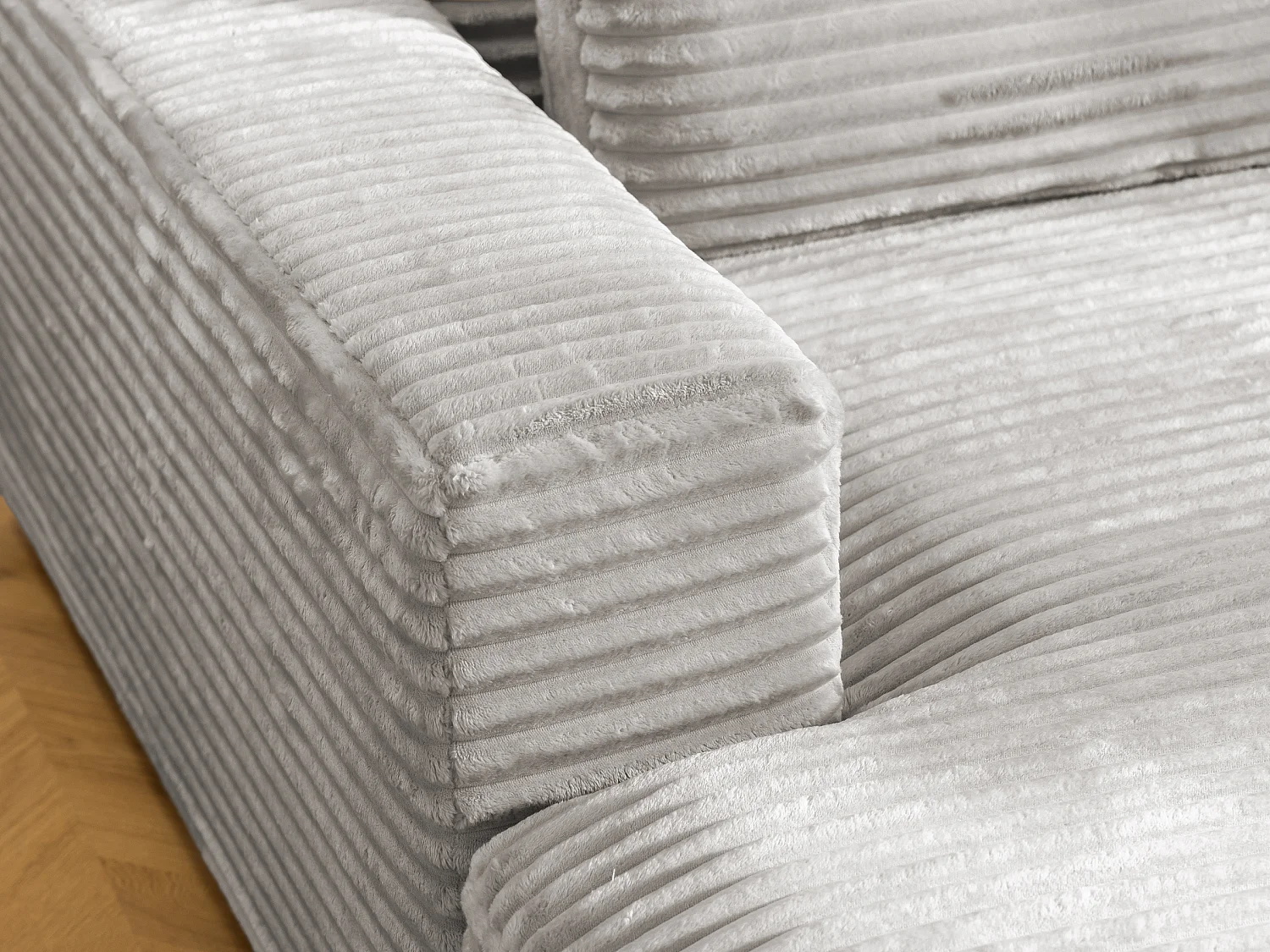 Canapé d’angle avec assise profonde, fonction couchage et pratique coffre de rangement, en tissu côtelé doux WOLKE