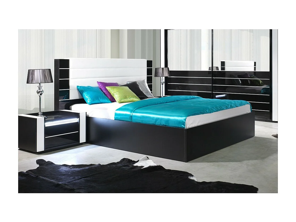Cama de casal 160 cm com opção de baú LINA. Cores preto e branco brilhante com acabamento em couro sintético. Estrado incluído.