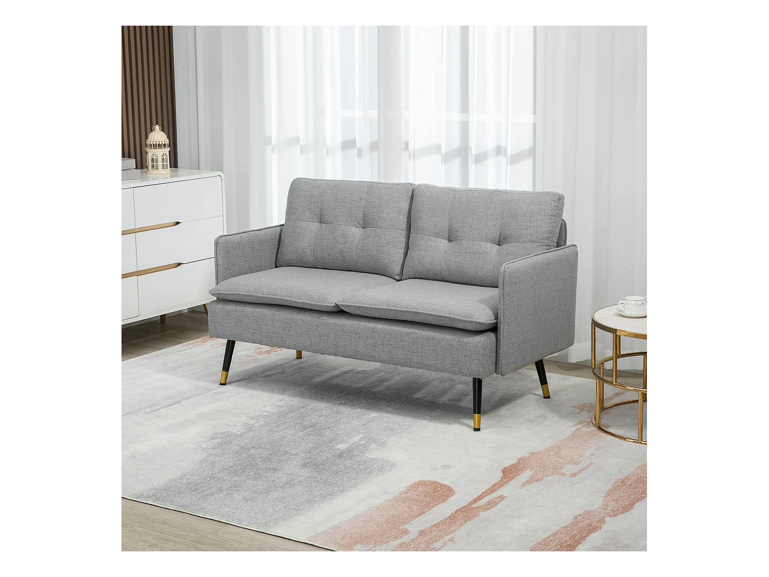 Canapé 2 places style art-déco dossier effet capitonné piètement incliné effilé métal noir extrémités dorées tissu gris