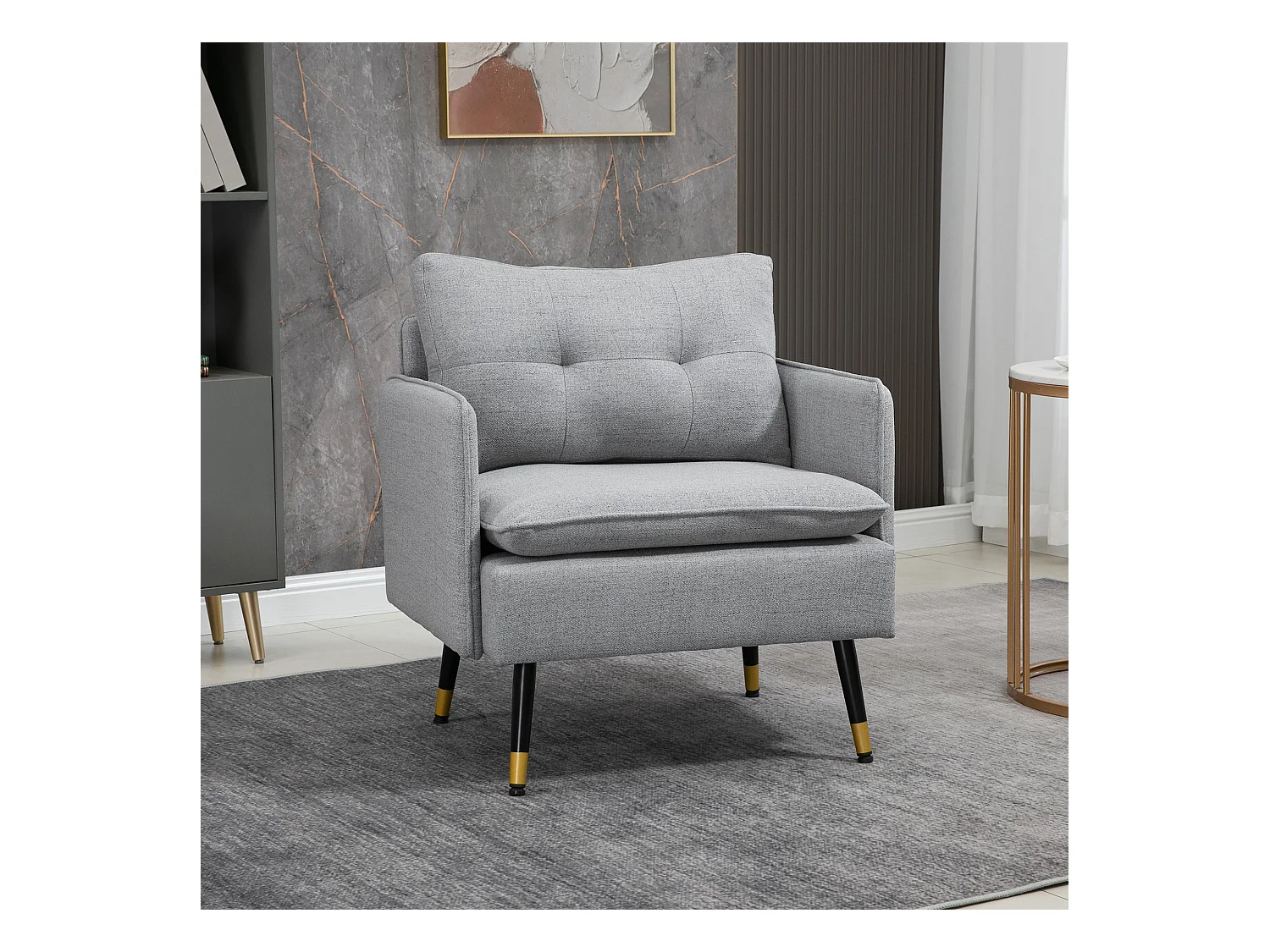 Fauteuil style art-déco dossier effet capitonné piètement incliné effilé métal noir extrémités dorées tissu gris