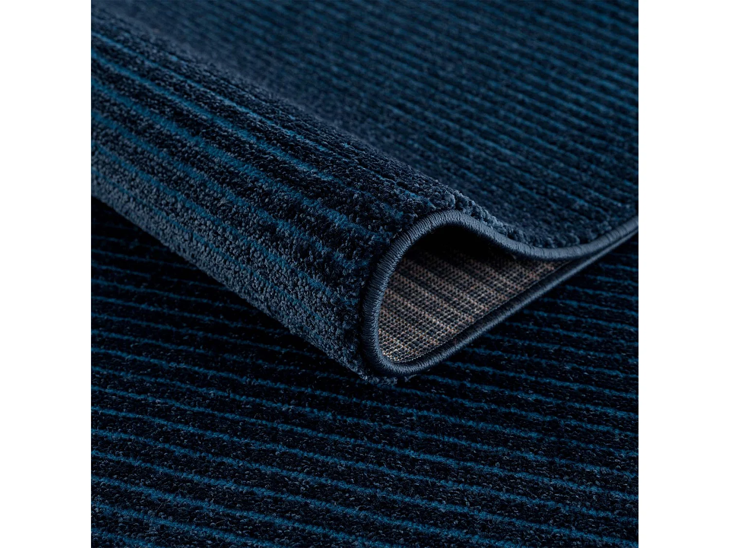 TARA - Tapis uni bleu à relief linéaire 140x200cm