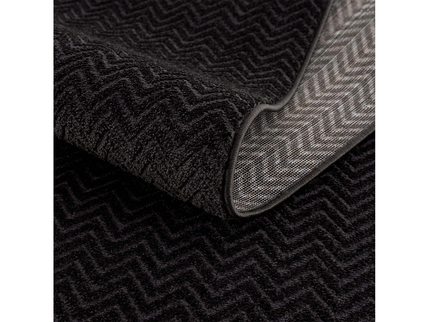 TARA - Tapis Rond uni noir à relief chevron 160x160cm