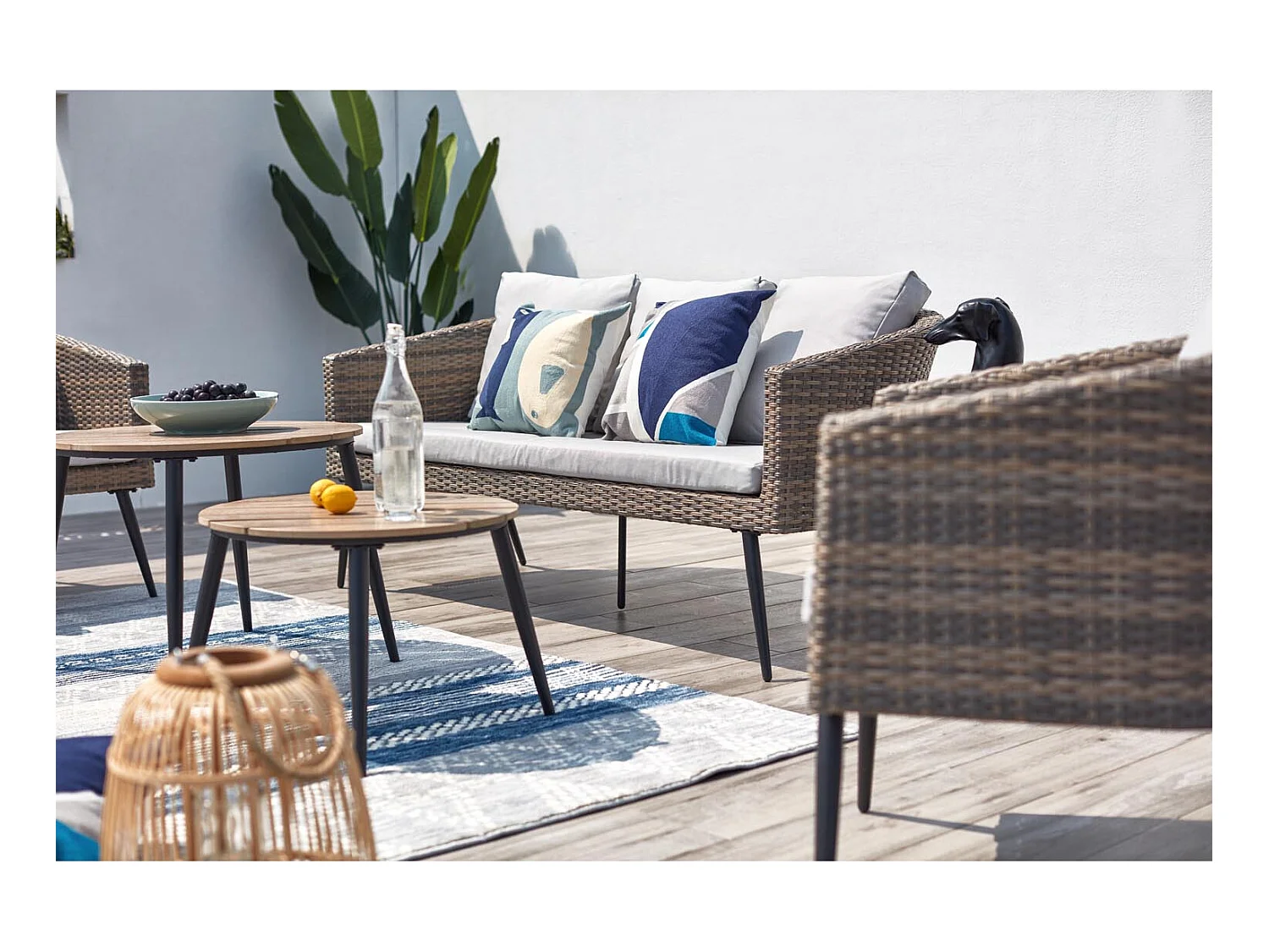 Loungeset Tibouta 5 plaatsen van gevlochten hars met schuine poten