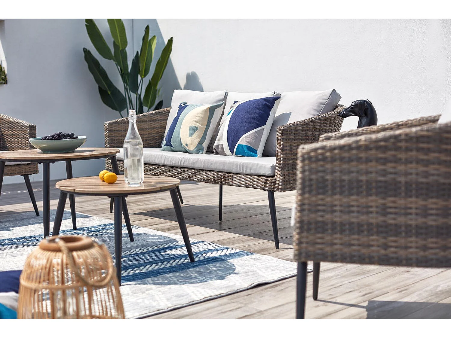 Loungeset Tibouta 5 plaatsen van gevlochten hars met schuine poten