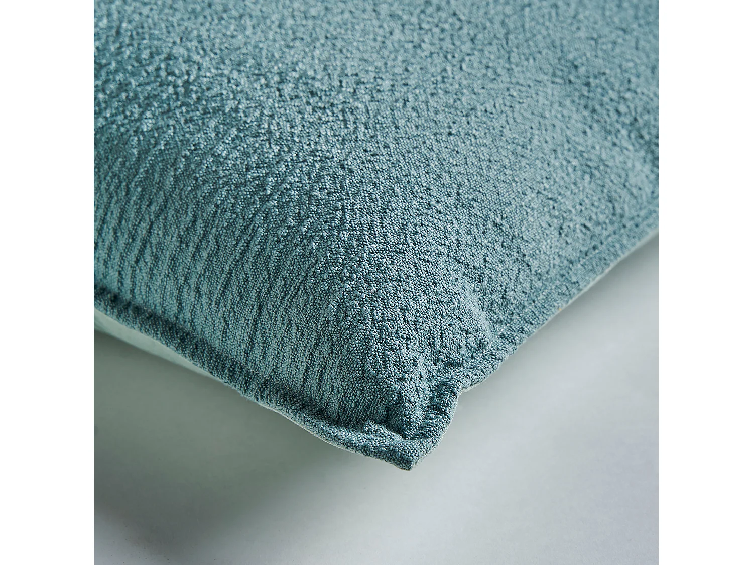 Cojín de poliéster en color azul de 42x42x10cm