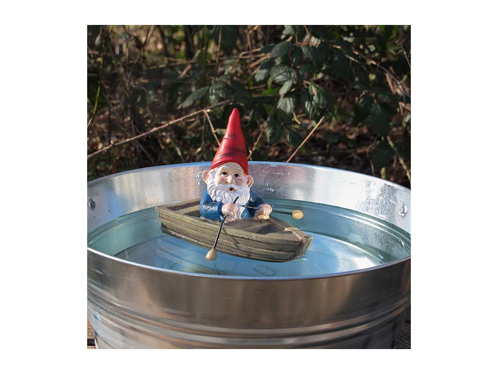 Nain de jardin en résine ballade sur l'eau Barque assis